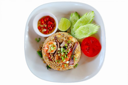 Fried rice with seafood, chilli sauce and  vegetables isolated on white background.の写真素材