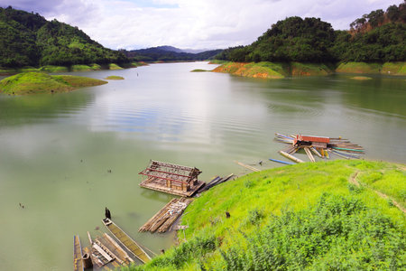 Landscape view of reservoir with water and mountain in Laos.の写真素材