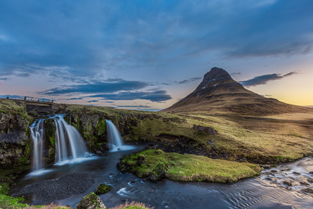 kirkjufellsfoss waterfall and kirkjufell mountain in the morning, Iceland.の写真素材