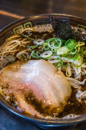 Kuro tonkotsu ramen with chashu pork and bean sproutの写真素材