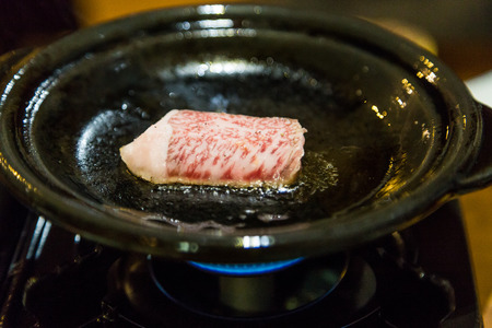 Cooking Saga beef steak on hot panの写真素材