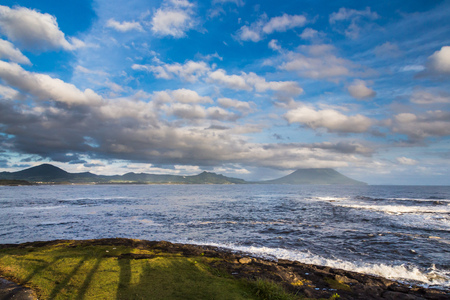 Beautiful clouds and ocean with Mt. Kaimon volcano, Kagoshima, Kyushu, Japanの写真素材