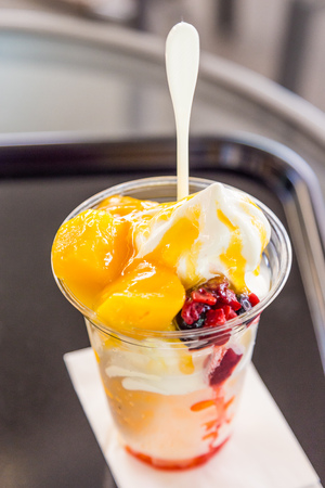 Delicious Mango ice cream sundae in plastic cup.の写真素材