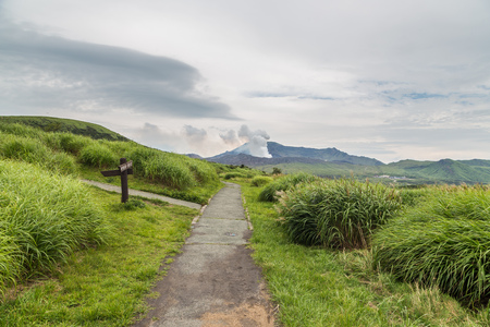 Erupting Mount Aso volcano view from natural trail in Kumamoto,  Kyushu, Japan.の写真素材