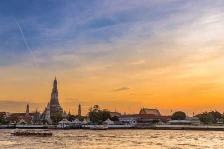 Wat Arun temple by Cho Praya River in sunset, Bangkok, THailand.の写真素材