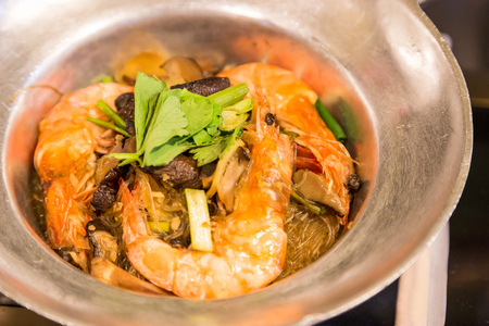 Thai seafood - Shrimp potted with vermicelli and herb.の写真素材