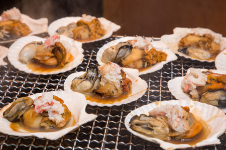 Seafood grill - street food in Tsukiji fish market, Tokyo, Japan.の写真素材