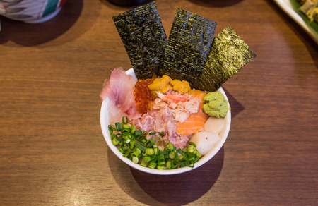 Mixed seafood donburi (rice bowl) with minced tuna, urchin and scallop.の写真素材