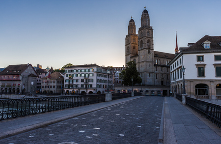 Grossmunster Church by Limmat river in Zurich old town at night, Switzerlandの写真素材