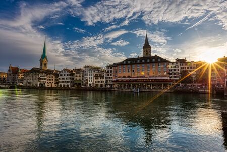 Beautiful view of Fraumunster Church and old town zurich by Limmat river before sunset, Switzerlandの写真素材