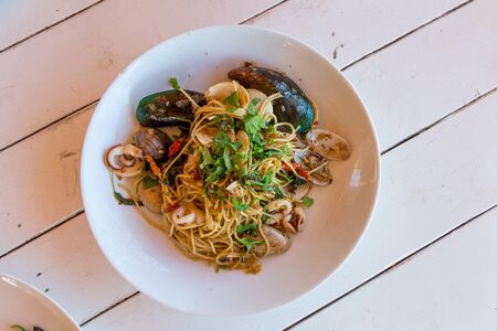 Thai style spaghetti with spicy seafood sauce.の写真素材
