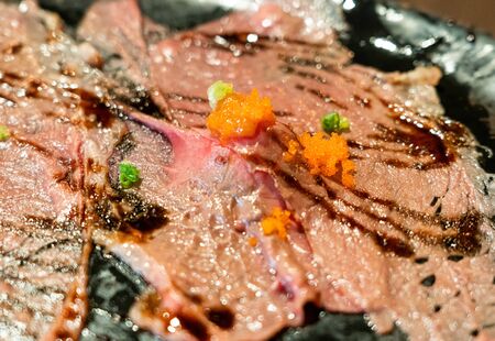 close wagyu beef sushi with spicy sauceの写真素材