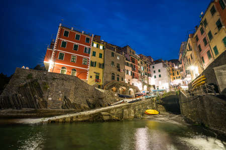 Riomaggiore town on Italian coastline at night in Cinque Terre, Italy.のeditorial素材