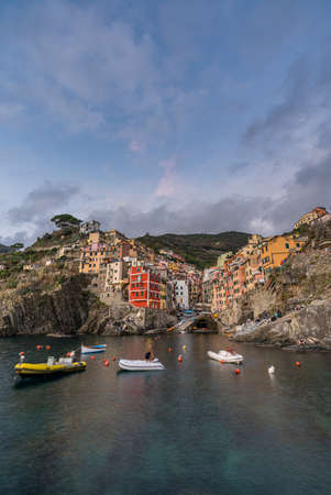 Riomaggiore town on Italian coastline at sunset in Cinque Terre, Italy.のeditorial素材