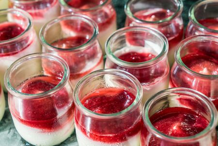 Berry yogurt in small jars for breakfast - close upの写真素材