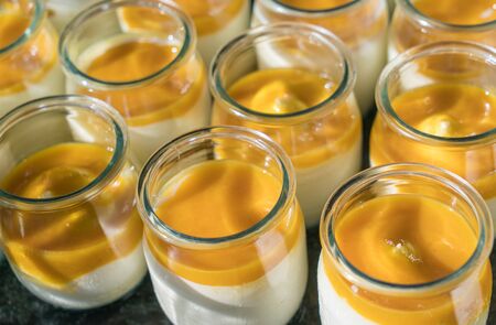 Mango yogurt in small jars for breakfast - close upの写真素材