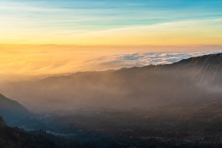 Beautiful sunrise over sea of fog at Mount Bromo in Bromo Tengger Semeru National Park, East Java,...