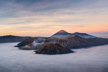 Beautiful sunrise at Bromo volcano mountain in East Java, Indonesia surrounded by morning fog