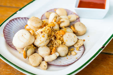 Fried scallop with garlicの写真素材