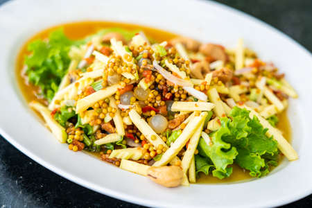 Thai spicy three eggs salad, popular thai seafood dish