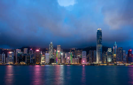 Hong Kong city skyline and skyscrapers at night, Victoria Harbor, Hong Kong, China.