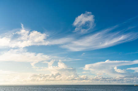 Golden cloudscape and blue sky in Indian ocean, Maldives islandの写真素材