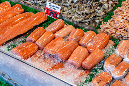 Fresh salmon fillets on fish stand in fish market at the Wharf Washington D.C.の写真素材