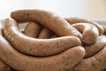 Fresh pork sausage with basilの写真素材