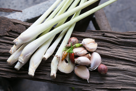 lemongrass  , chili , garlic and red onion on wooden backgroundの写真素材