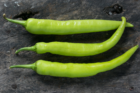 chili on wooden backgroundの写真素材