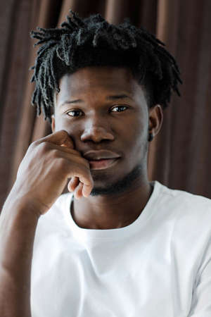 Close-up portrait of young African American man with dreadlocks.の写真素材