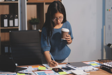 The designer team is designing the system to make the system work well on new phones and support system updates. Website development concept UI UX front end designerの写真素材