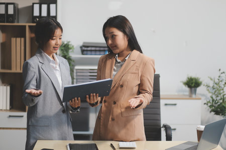 Workers discuss them at the company conferenceの写真素材