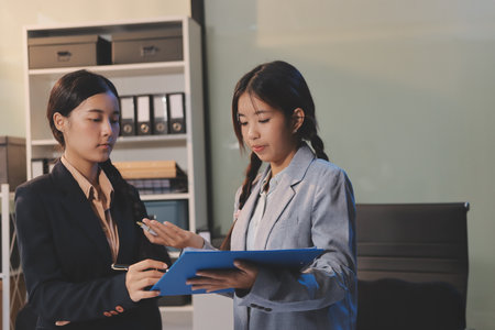 teamwork of young business with documents in office. Discussion, meeting, or business meeting conceptの写真素材