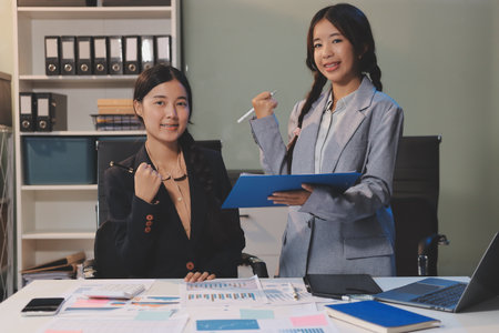 Accounting company provide finance and taxation planning for profitable cash flow, Auditor and accountant team working in office, analyze financial data and accounting record with calculator.Insightの写真素材