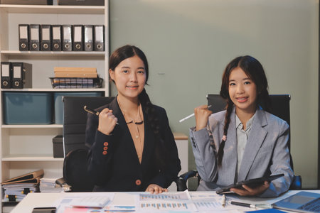 Accounting company provide finance and taxation planning for profitable cash flow, Auditor and accountant team working in office, analyze financial data and accounting record with calculator.Insightの写真素材