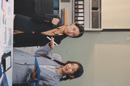 teamwork of tired young business with documents tax laptop computer in office. Sad, unhappy, Worried, Depression, or employee life stress conceptの写真素材