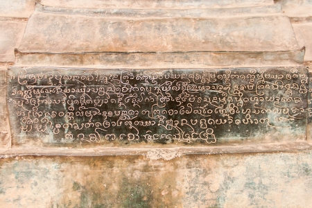 Ancient inscription in Laos temple on pole base の写真素材