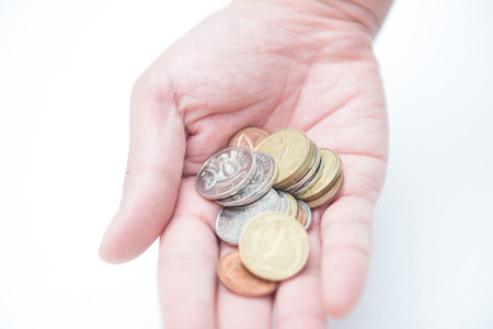 Hand holding coins