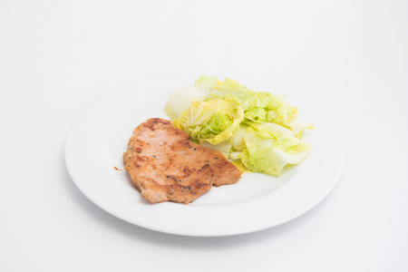 Pork Steak with chinese  cabbage on isolated.の写真素材