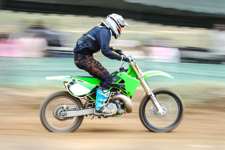 Motion blurred of motocross bike competitionの写真素材