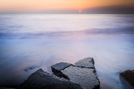 Rock on the beach in the morning at Chonburi, Thailand.の写真素材