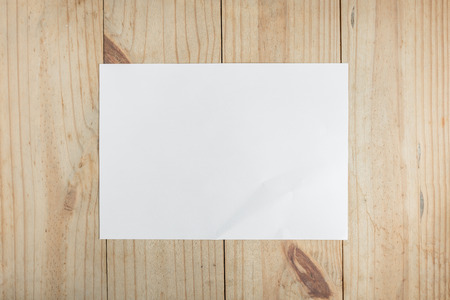 white paper on wooden background