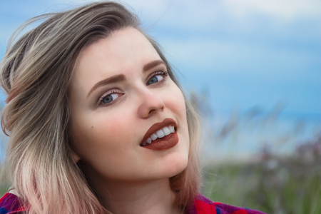Fashion portrait of young hipster women with pretty red lips Summer concept, sandy beach, bright sky...
