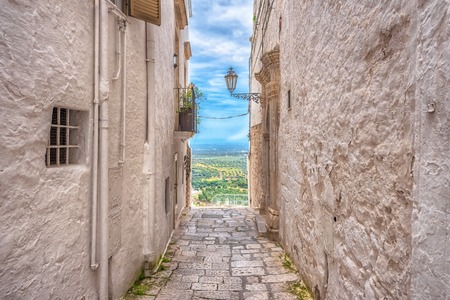 Alleyway in old white town Ostuni, Puglia, Italyの写真素材