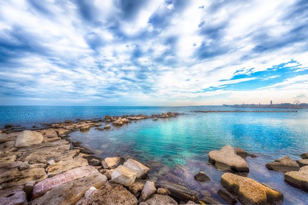 View of the Adriatic Sea. Beautiful seascape with stones, Bari, Puglia, South Italyの写真素材