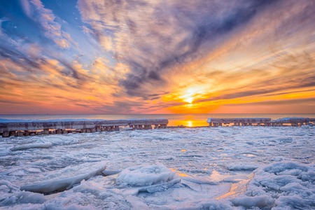 Fantastic view of the sea landscape with ice floe. Sunset at the Baltic seaの写真素材