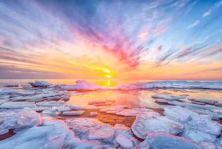 Fantastic view of the sea landscape with ice floe. Sunset at the Baltic seaの写真素材
