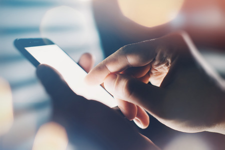 Closeup of hand using smartphoneの写真素材