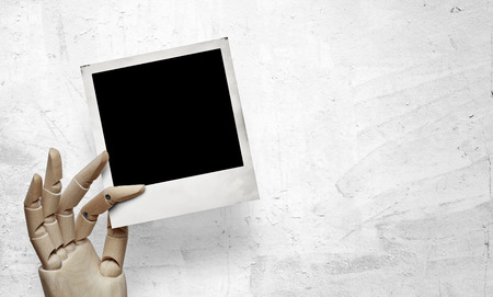 Wood hand with instant frameの写真素材